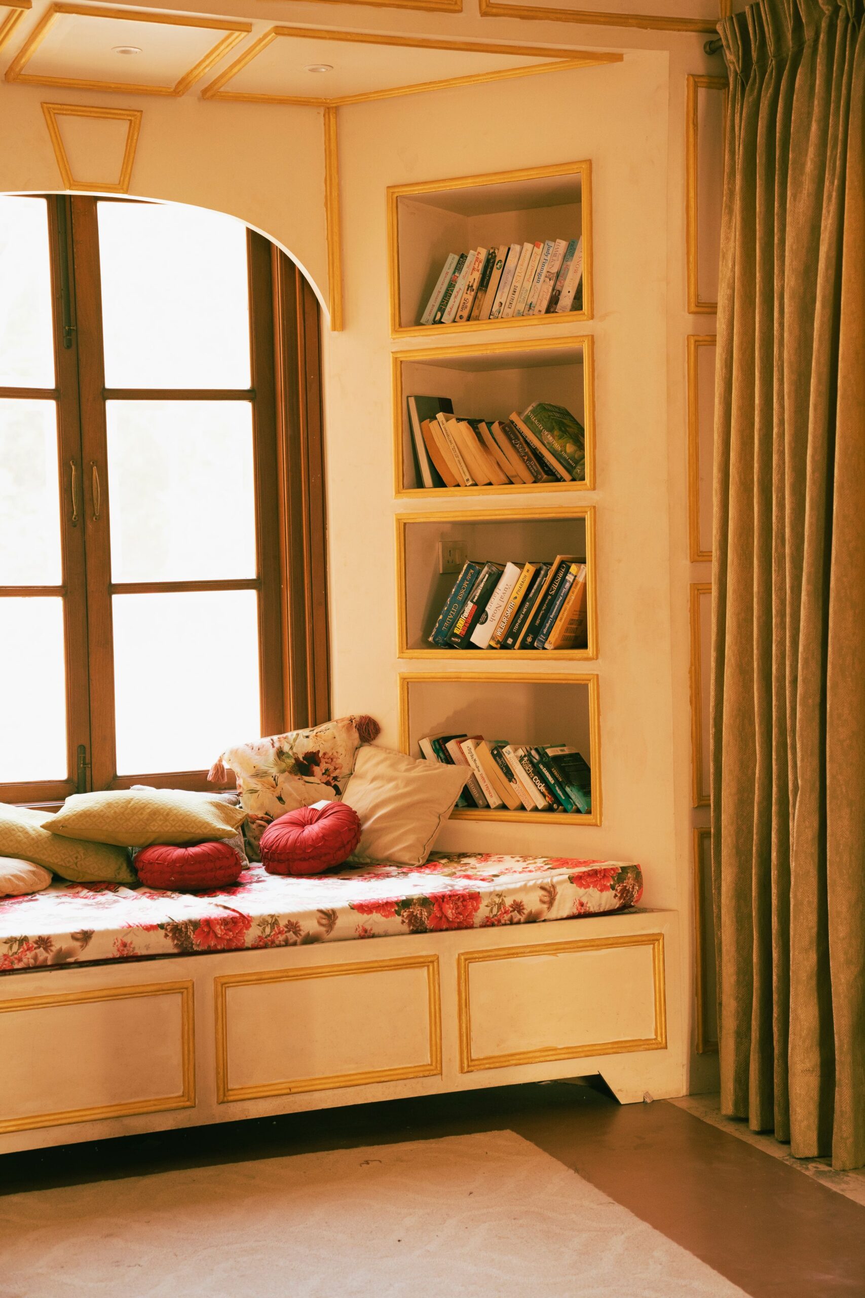 7 Cozy Reading Nook Ideas That Make You Want to Sit Down and Stay 2 Window seat bench with cushions and a built-in bookshelf