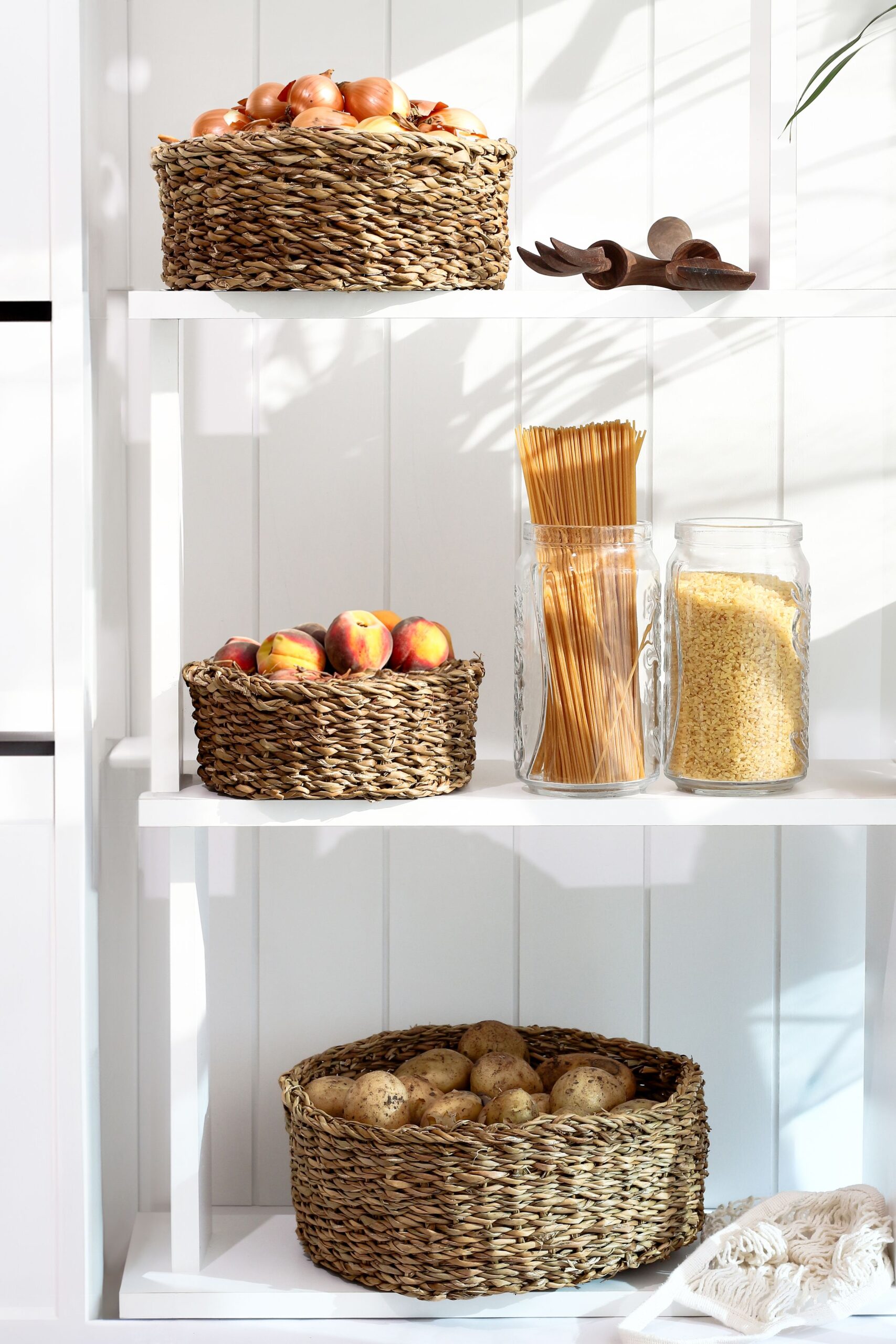 7 Pantry Organization Ideas That Actually Stay Organized 8 Organized pantry shelf with fresh produce and breathing room