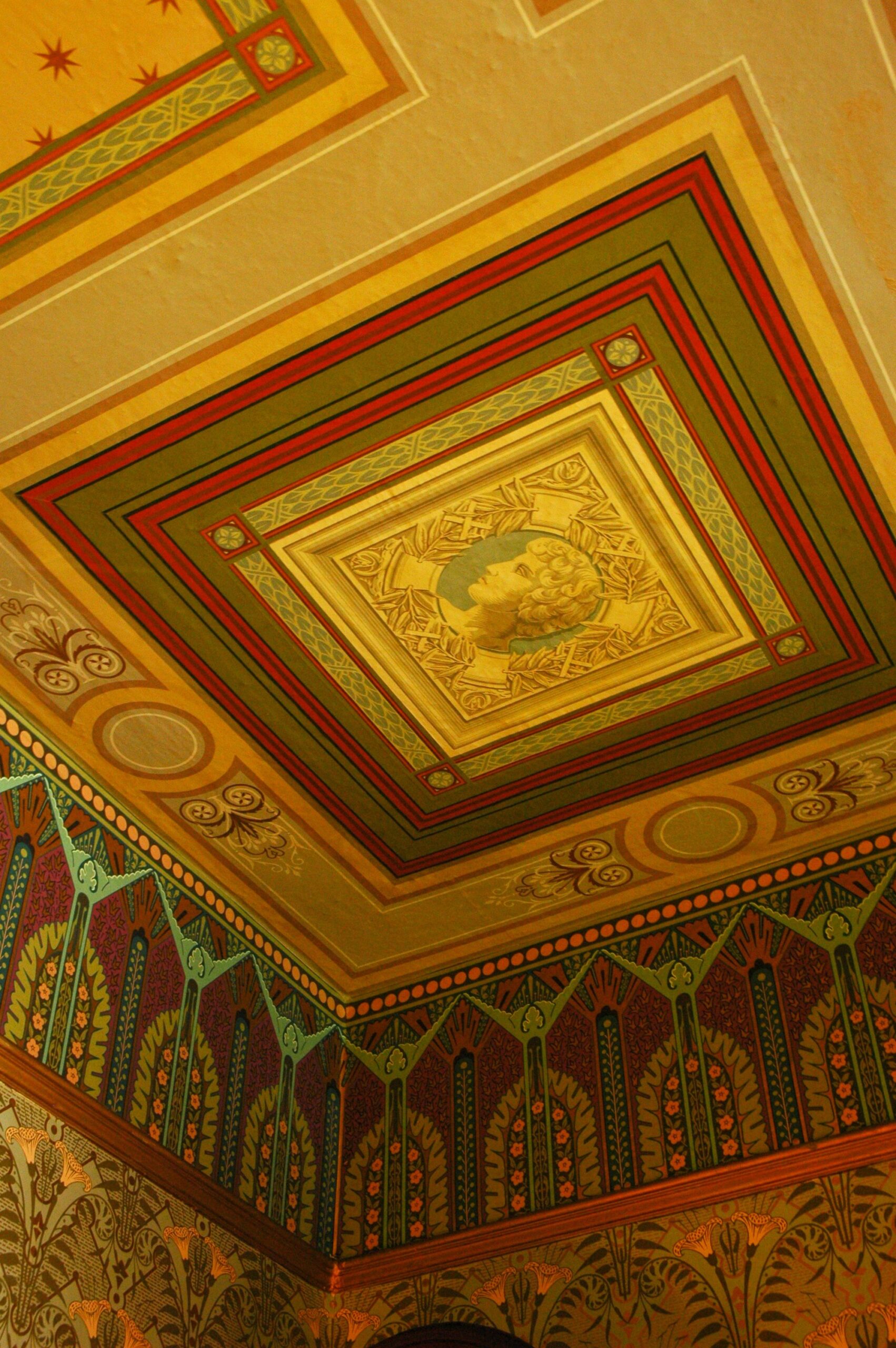 Patterned wallpaper covering a ceiling as a decorative fifth wall