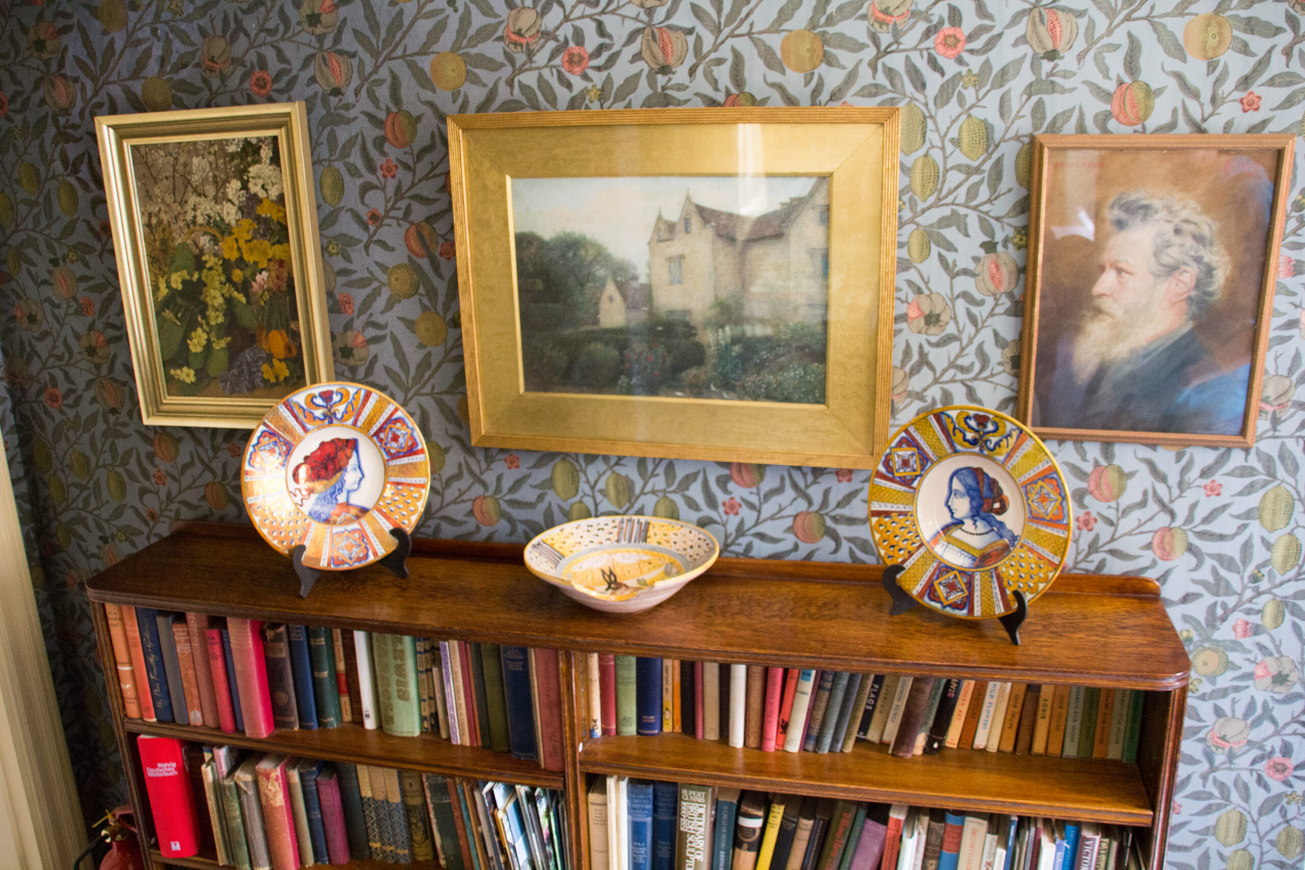 Historic manor house interior room decorated with patterned wallpaper