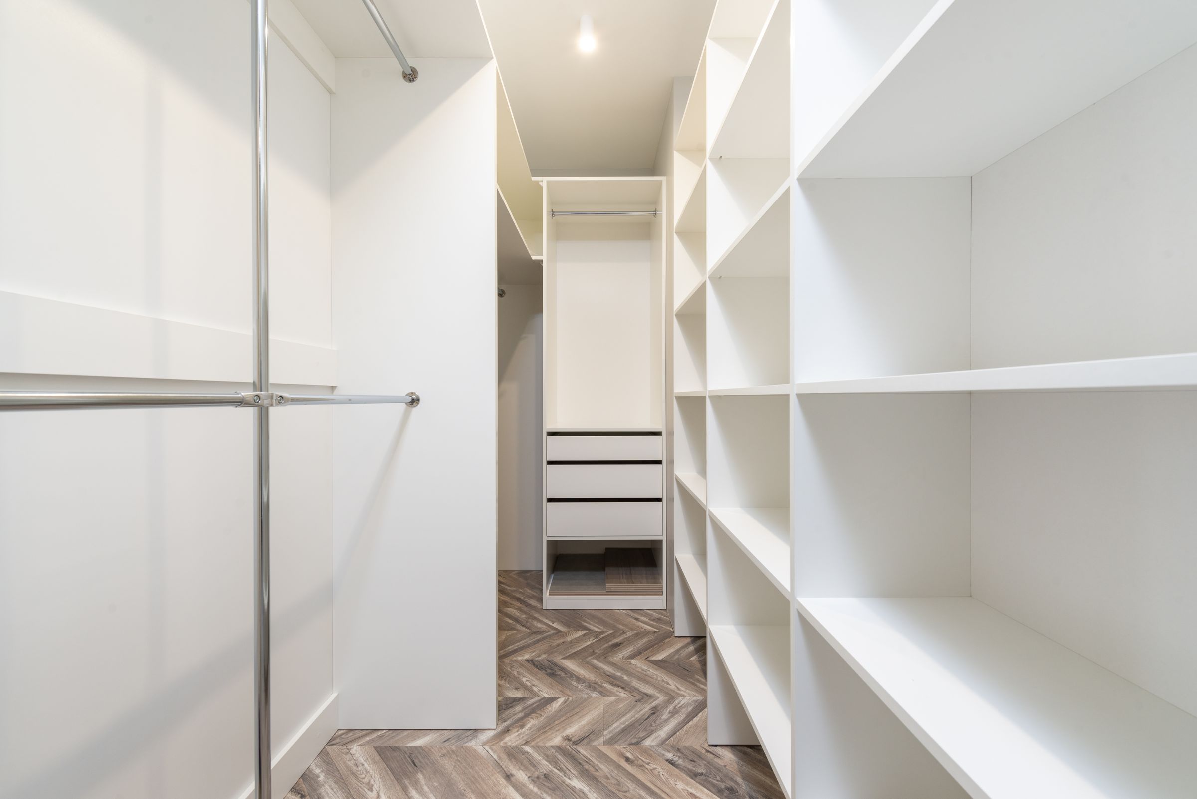 Closet Organization Ideas That Actually Make Getting Dressed Easier 2 Modern walk-in closet with double hanging rods and open shelving, photo by Max Vakhtbovych via Pexels