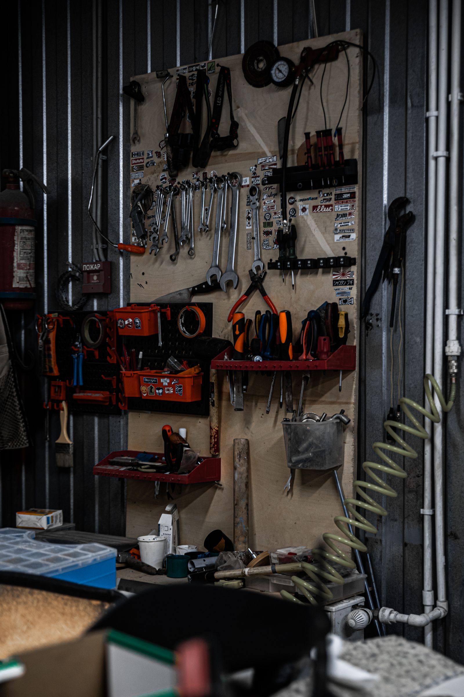 Garage Organization Ideas That Make Room for the Car Again 3 Neatly organized pegboard wall of hand tools and power tools in a home workshop, photo by iddea photo via Pexels
